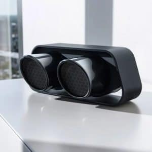 Portabler High-End Bluetooth Speaker aus der original Endrohrblende des 911 GT3. Verwendung hochwertiger Materialien wie Aluminiumgehäuse. Bluetooth 4.0 und apt-X Technologie für kabellose Musikübertragung von Smartphones, Tablets und PCs in CD-Qualität. 60 Watt Systemleistung. True Wireless Modus (Die True Wireless Funktion bietet die Möglichkeit, Ihren 911 Speaker kabellos mit einem weiteren 911 Speaker als zweite Schallquelle im gleichen Raum zu verbinden), einfachste Verbindung mit Endgerät mittels NFC Technologie. Mit der integrierten Lithium Ionen Batterie können Sie Musik für bis zu 24 Stunden mobil und unabhängig von einer Steckdose wiedergeben. Die Wiedergabedauer richtet sich dabei hauptsächlich nach der Umgebungstemperatur, der abgespielten Musik und der eingestellten Lautstärke. SYSTEMLEISTUNG 60 Watt Maximalaler Schalldruck: 95 dB SPL Akkulaufzeit bis zu 24 Std BLUETOOTH Bluetooth® Standard 4.0 [A2DP] Unterstützt CSR aptX® Dekodierung Reichweite bis 10 m Frequenzbereich 2.400-2.483,5 [2,4 GHz ISM Band] Max. Sendelesitung mW [+10 dBm] GEWICHT ca. 3,3 kg ANSCHLÜSSE AUX-IN DC IN [12 V 1,5 A] Mini-USB-IN [Service-Buchse]