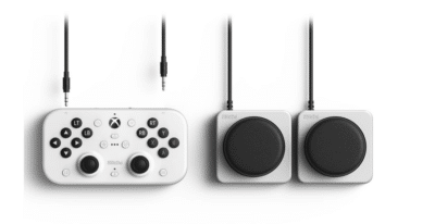 8Bitdo Lite SE 2.4G Wireless Controller neben zwei übergroßen, einzelnen Buttons
